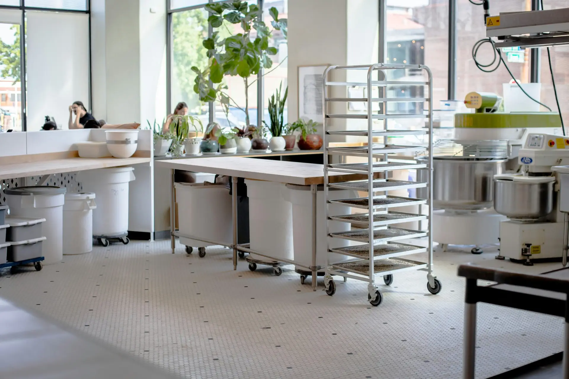 Professional commercial kitchen with stainless steel surfaces and cooking equipment